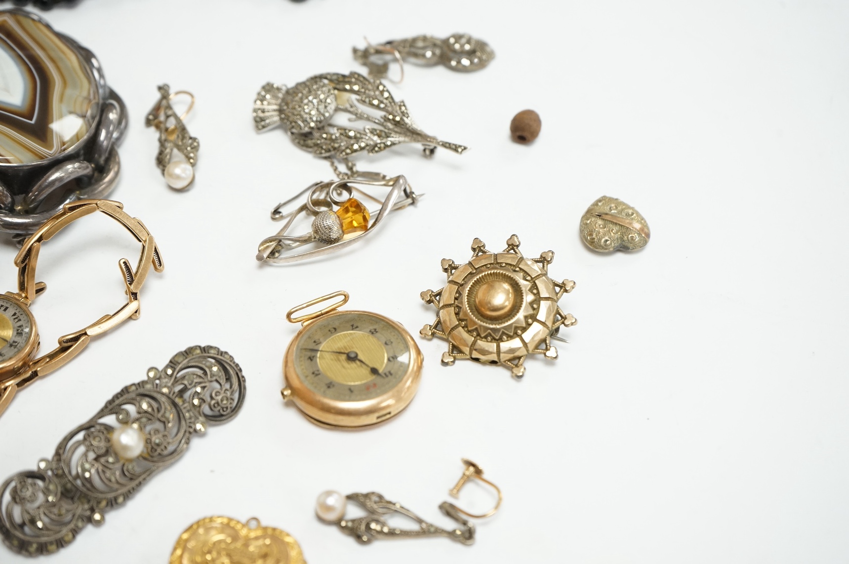 A small collection of assorted jewellery etc. including two 9ct gold wrist watches, one on a 9ct strap, a banded agate set brooch. Condition - poor to fair to good